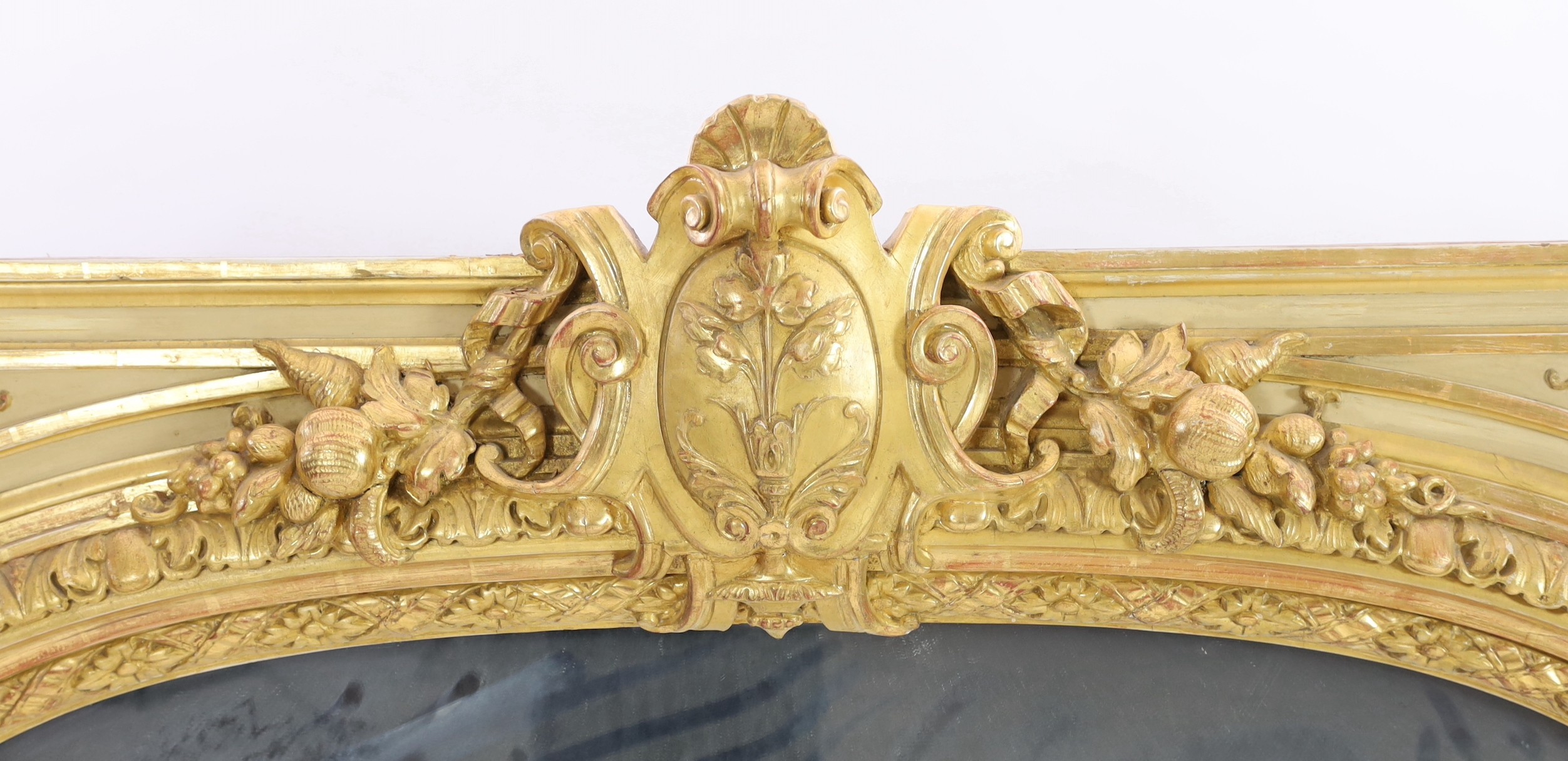 A late 19th century French carved giltwood wall mirror, W.146cm H.171cm